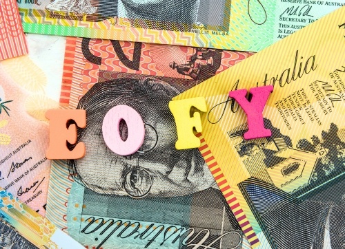 colourful block spelling out EOFY on top of Australian dollars