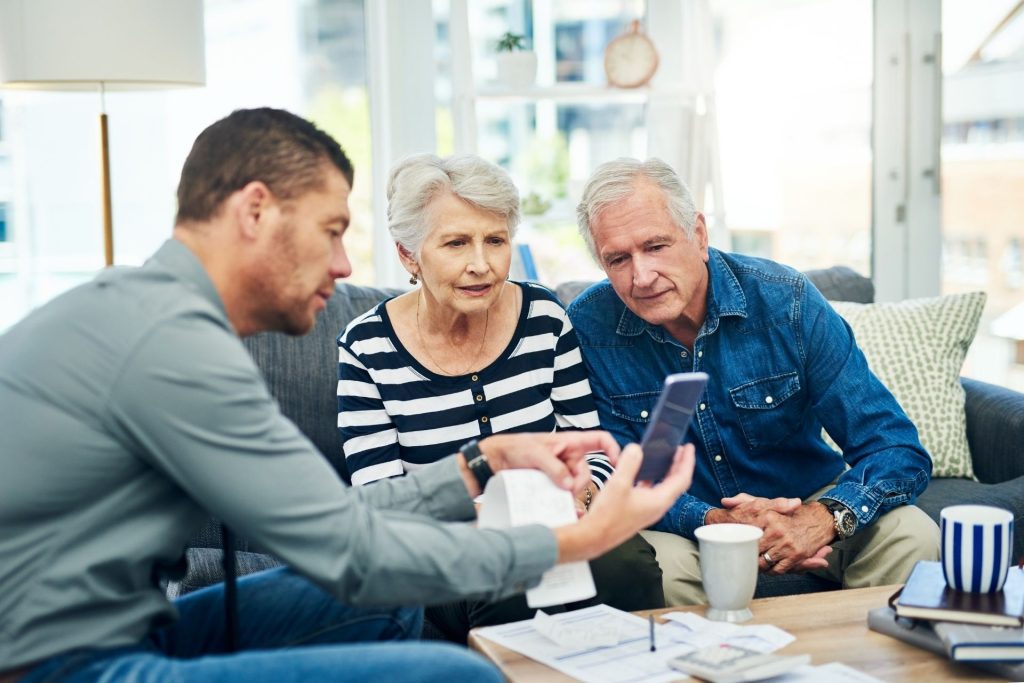 Older couple working out finances with a financial planner