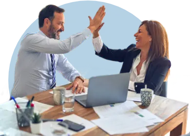 A business man and a woman giving a 'high 5'